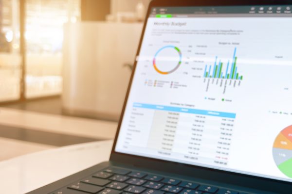 A marketer analyzing UTM tracking data on a laptop using UTMGrabber for campaign insights