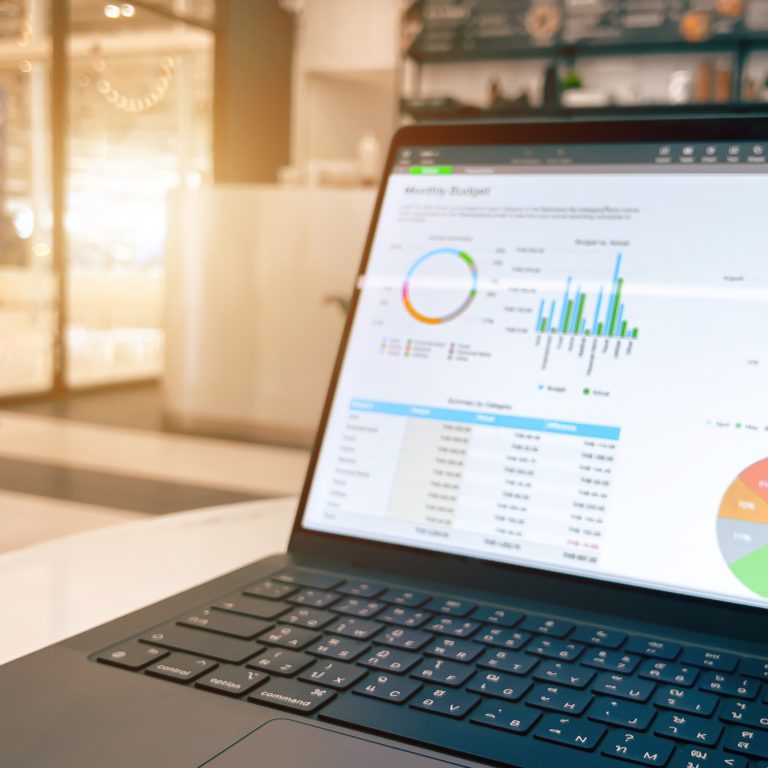 A marketer analyzing UTM tracking data on a laptop using UTMGrabber for campaign insights